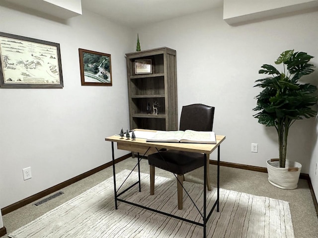 office space featuring light carpet