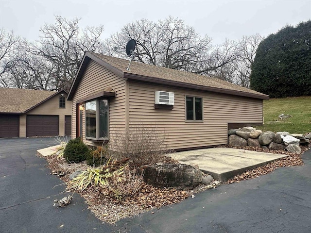 view of property exterior with a garage