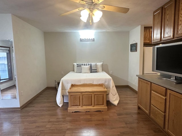 bedroom with ceiling fan and dark wood-type flooring