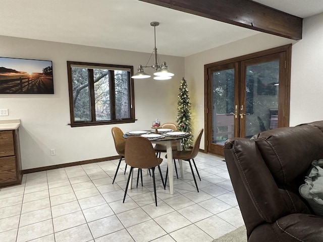 dining area featuring french doors, light tile patterned floors, beamed ceiling, and an inviting chandelier