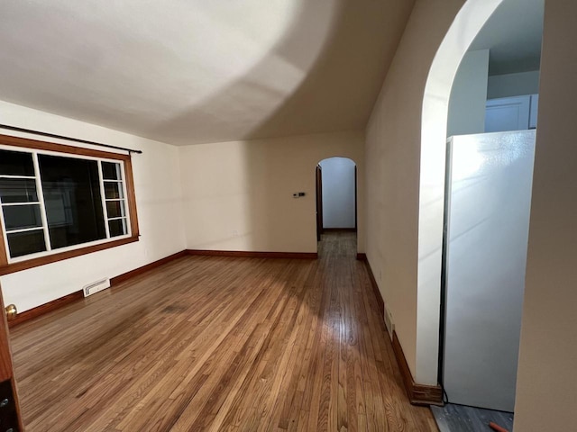 additional living space with wood-type flooring