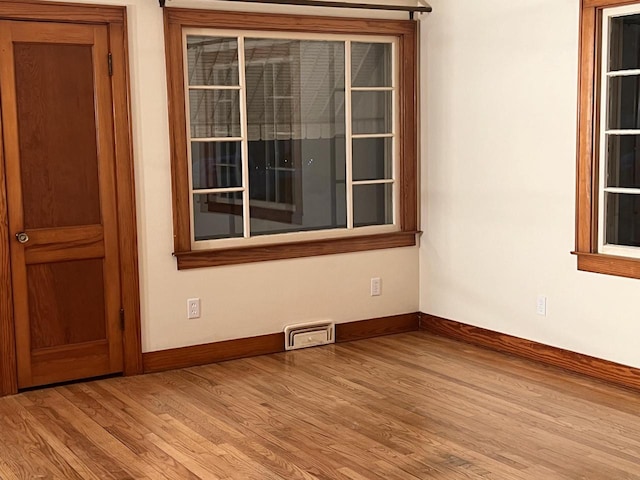 spare room with light hardwood / wood-style floors