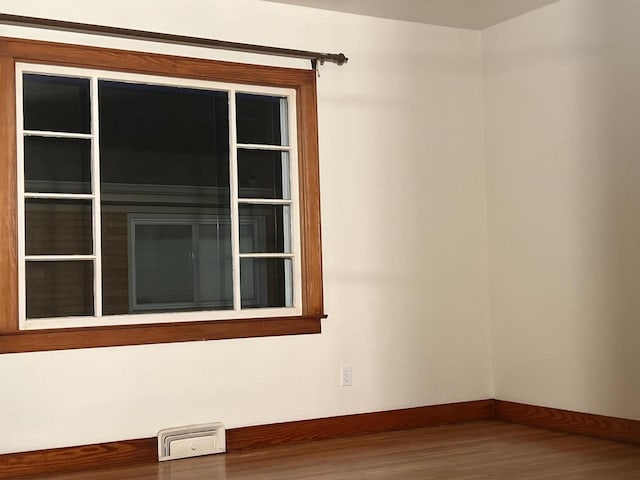 empty room with wood-type flooring