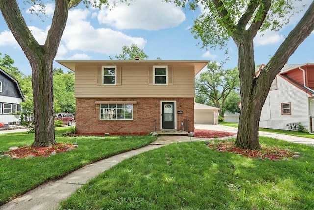 view of front of home featuring a garage and a front lawn