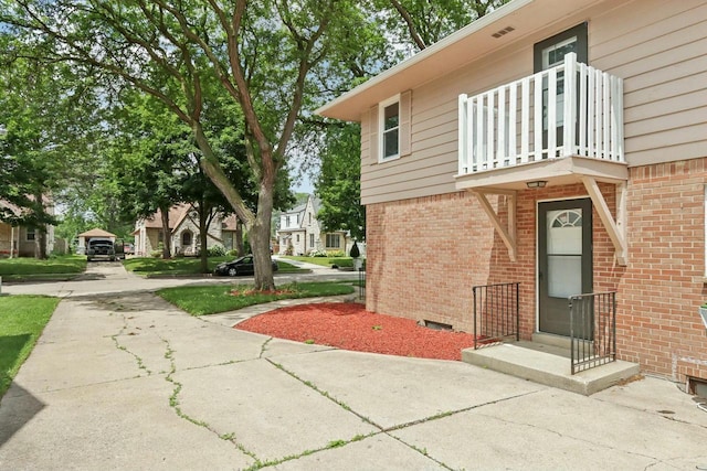 doorway to property with a balcony