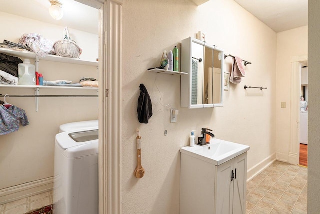 130 W Maple St, Viroqua, WI 54665 - laundry area with baseboards and separate washer and dryer