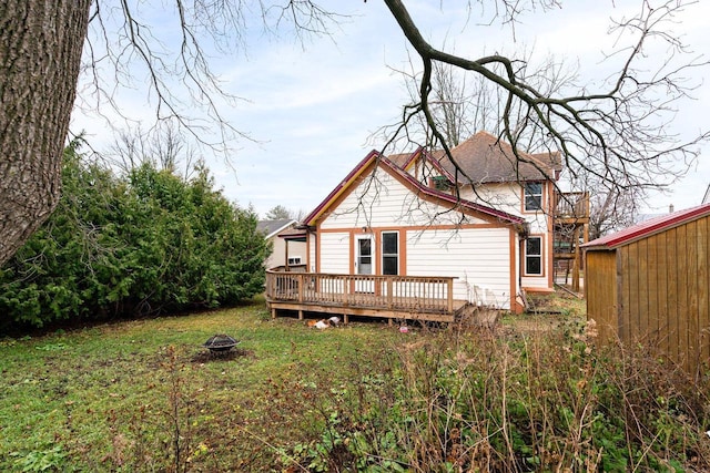 130 W Maple St, Viroqua, WI 54665 - rear view of property with a fire pit, a wooden deck, and a yard