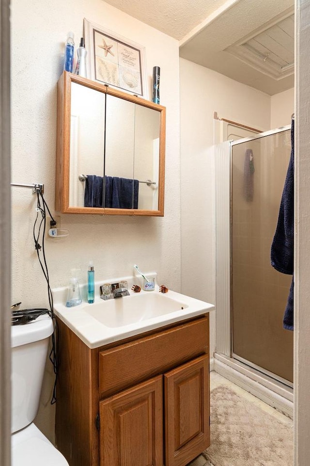 130 W Maple St, Viroqua, WI 54665 - bathroom featuring vanity, a shower stall, and toilet