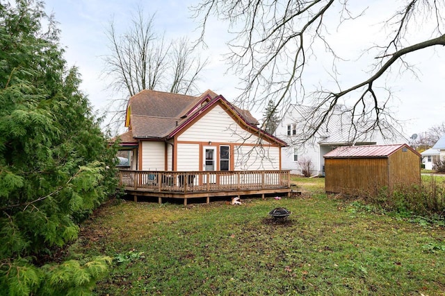 130 W Maple St, Viroqua, WI 54665 - back of property with a deck, an outdoor fire pit, and a yard