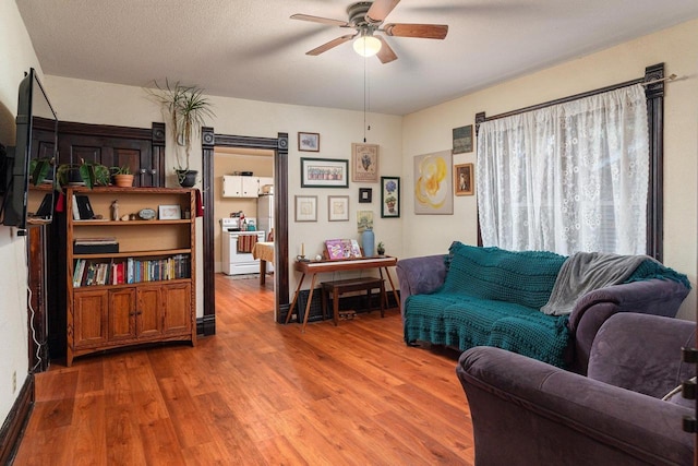 130 W Maple St, Viroqua, WI 54665 - living room with wood finished floors and a ceiling fan