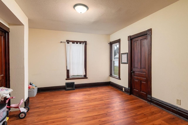 130 W Maple St, Viroqua, WI 54665 - unfurnished room with wood finished floors and baseboards