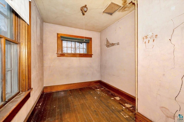 spare room with dark wood-type flooring