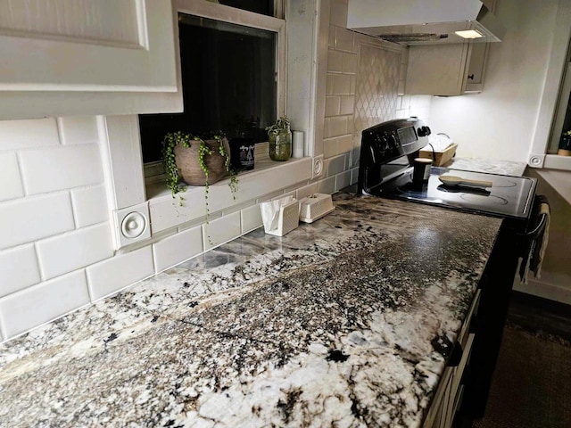 kitchen with stainless steel range oven and range hood