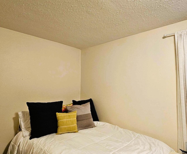 bedroom featuring a textured ceiling