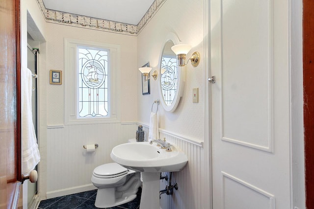 2572 N Shore Dr, Delavan, WI 53115 - bathroom with a wainscoted wall, toilet, and tile patterned flooring