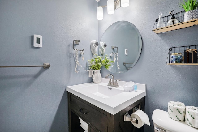 bathroom with vanity and toilet