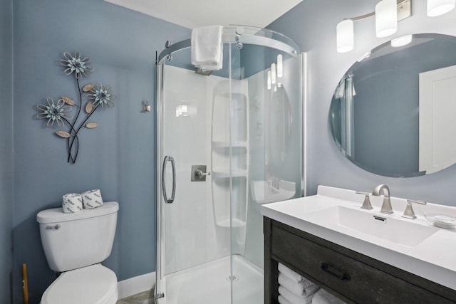 bathroom featuring vanity, toilet, and walk in shower