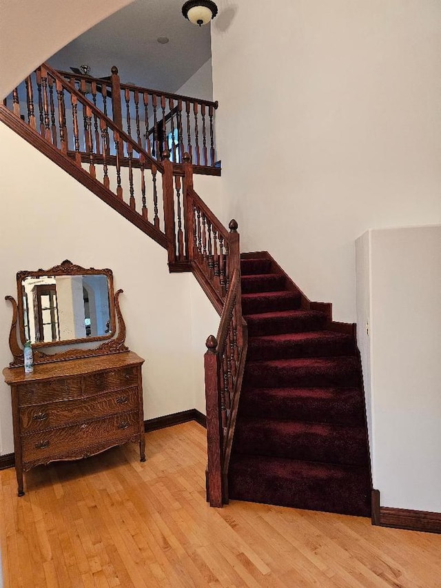 stairs with wood-type flooring