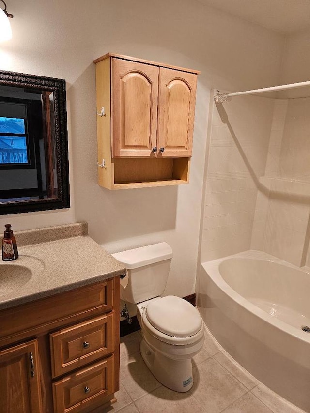 full bathroom with tile patterned floors, shower / bathing tub combination, vanity, and toilet