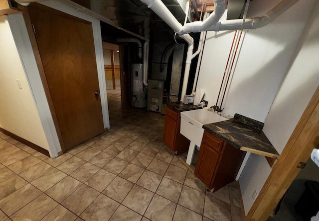 interior space with gas water heater and sink