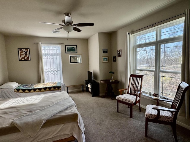 carpeted bedroom featuring ceiling fan