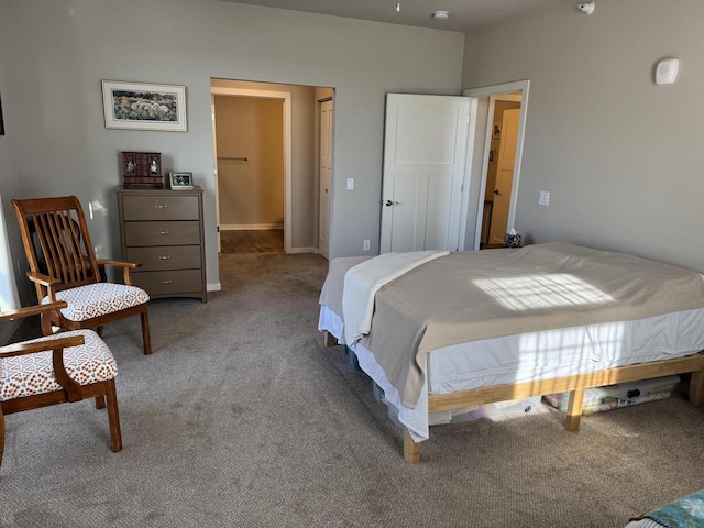 bedroom with light colored carpet and a closet