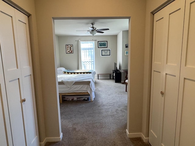 carpeted bedroom featuring ceiling fan