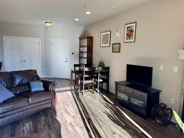 living room with dark wood-type flooring