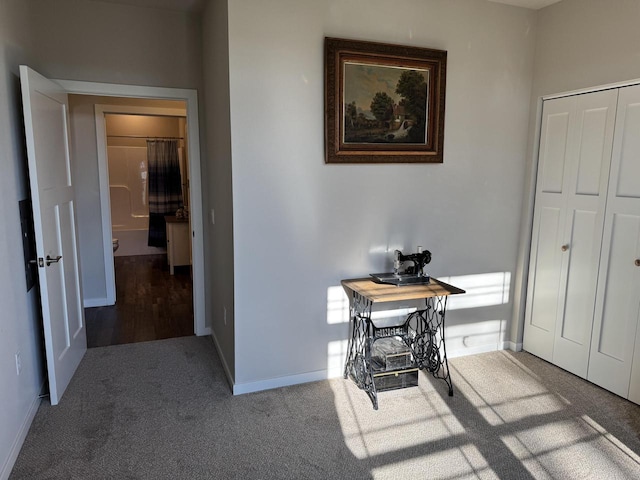 corridor featuring carpet flooring