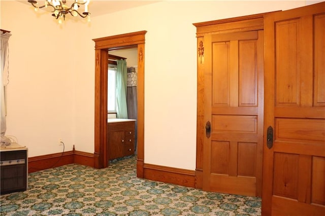 corridor featuring an inviting chandelier