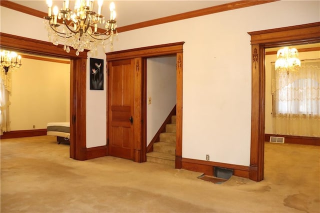 empty room featuring light carpet, crown molding, and a notable chandelier