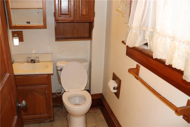 bathroom featuring vanity and toilet