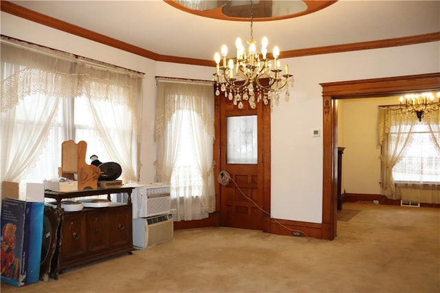 interior space featuring crown molding, a healthy amount of sunlight, and an inviting chandelier