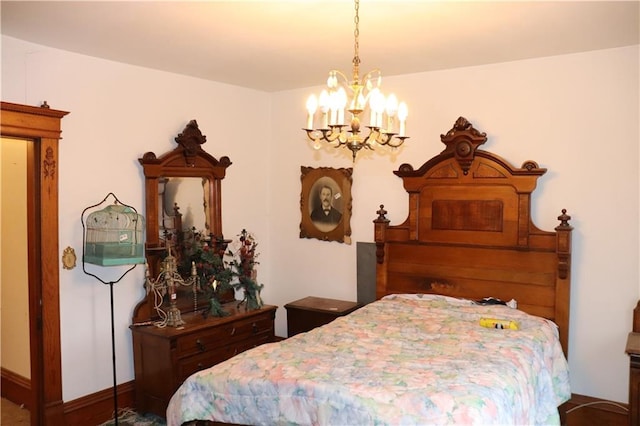bedroom featuring an inviting chandelier