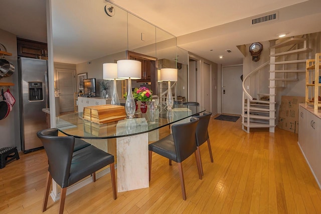 dining room with light hardwood / wood-style flooring