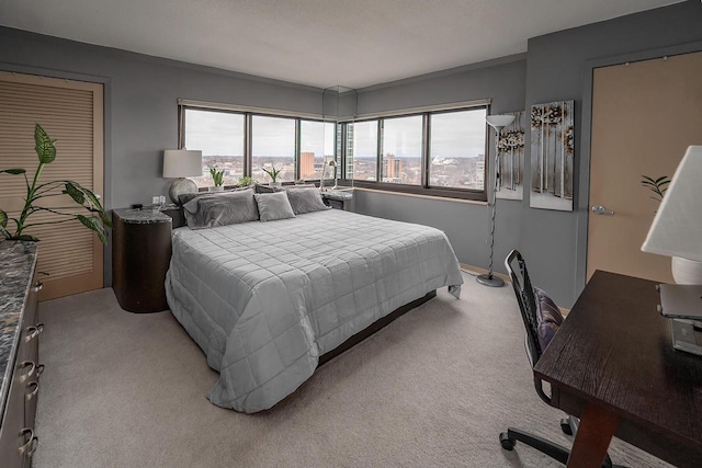 bedroom featuring light colored carpet