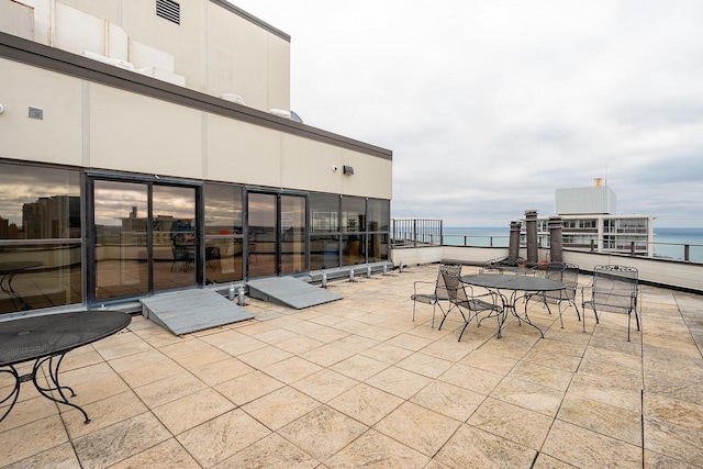 view of patio / terrace with a water view