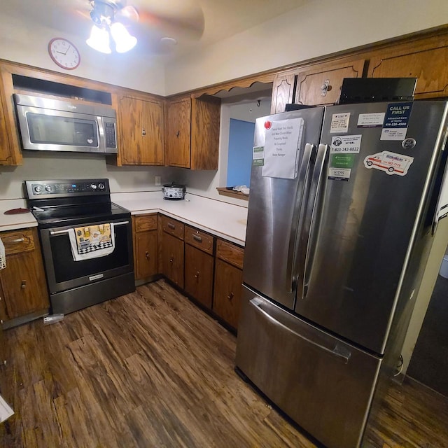 kitchen featuring dark hardwood / wood-style flooring and stainless steel appliances