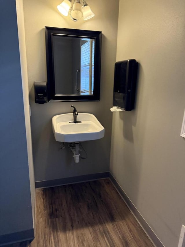 bathroom with hardwood / wood-style flooring and sink