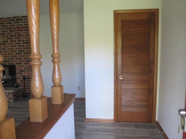 hallway with dark hardwood / wood-style floors