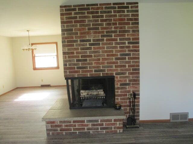 room details with a fireplace and wood-type flooring