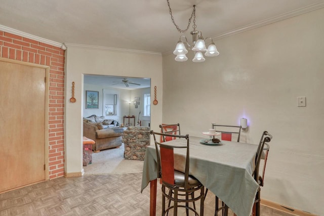 dining space featuring ceiling fan with notable chandelier, crown molding, and light parquet floors