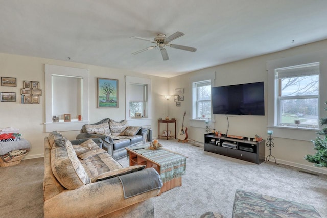 living room featuring carpet flooring and ceiling fan