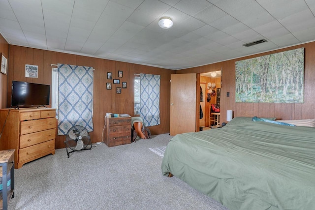 bedroom featuring wooden walls