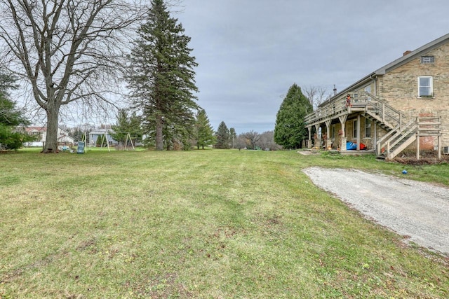 view of yard featuring a wooden deck