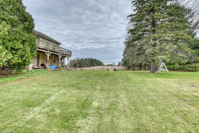 view of yard with a wooden deck