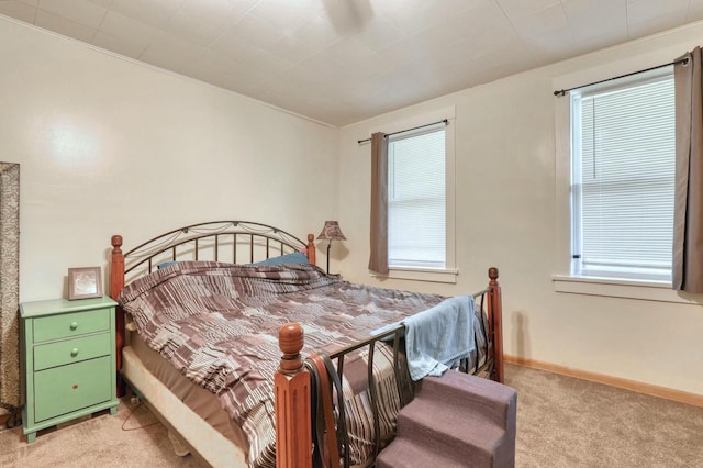 bedroom featuring light colored carpet