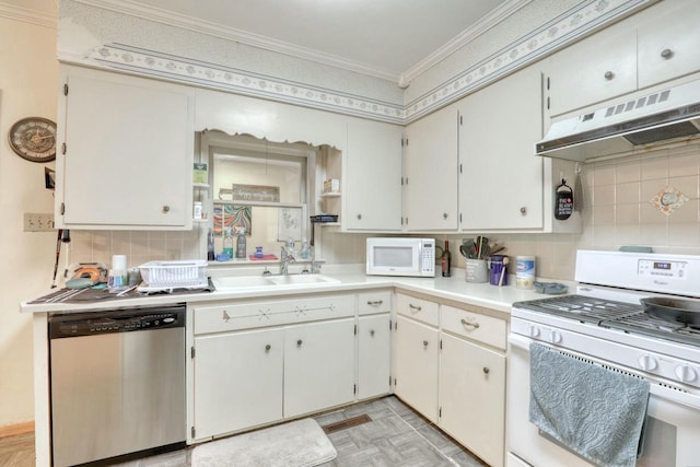 kitchen with decorative backsplash, sink, white appliances, and ornamental molding