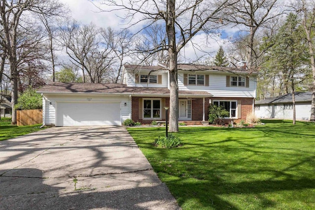 front of property with a front lawn and a garage