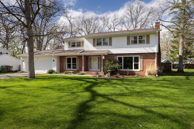 view of front facade with a front yard and a garage